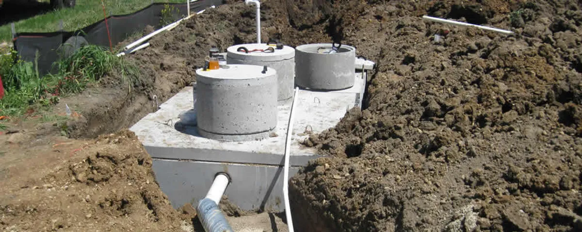 Septic system repair and installation site with tank access ports in Redmond, WA