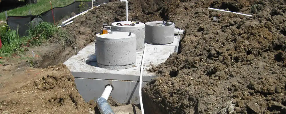 Septic system repair and installation site with tank access ports in Redmond, WA