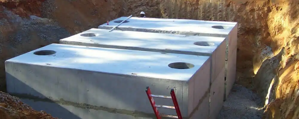 Septic tank installation site with a newly placed concrete tank in Redmond, WA